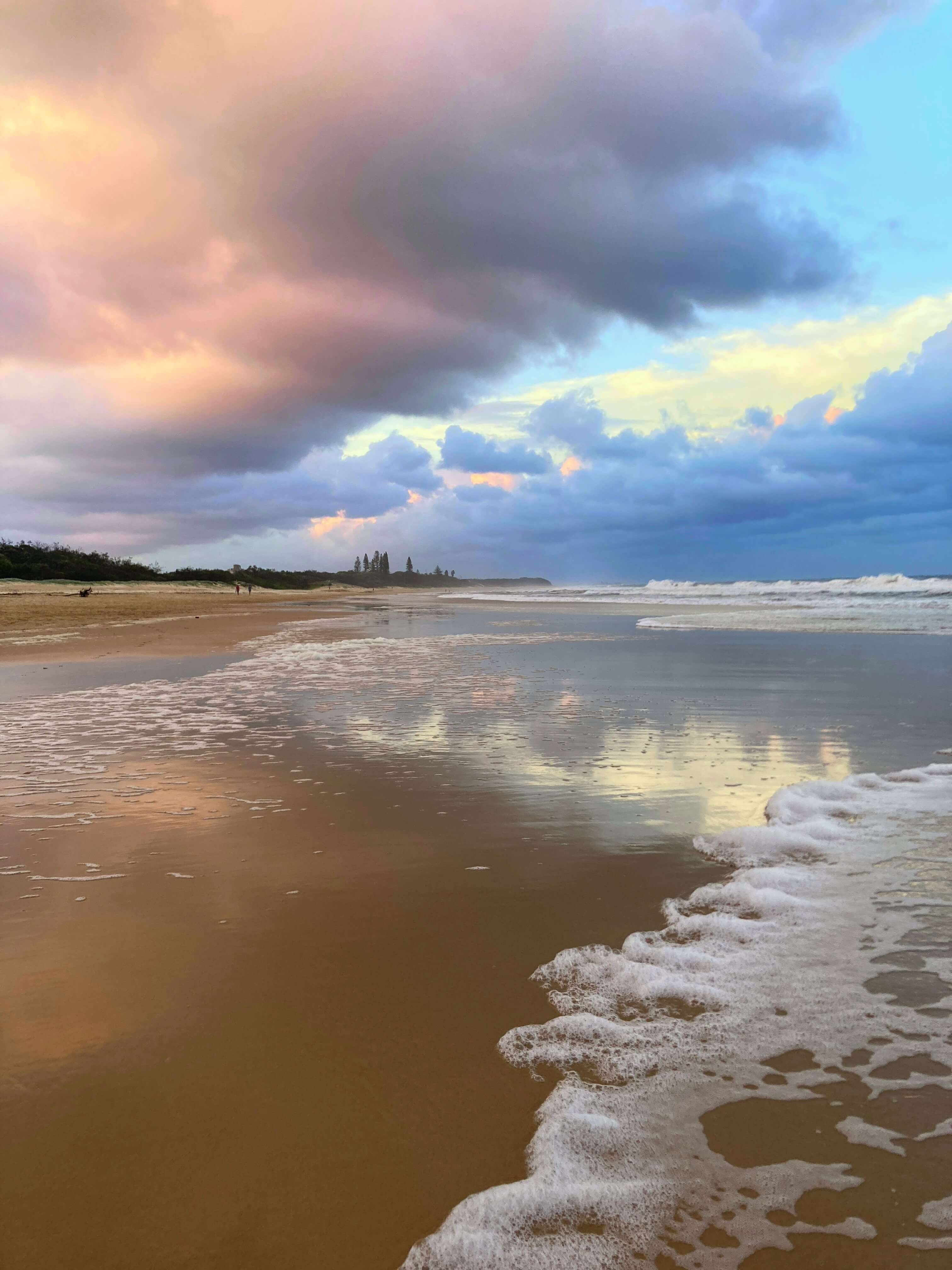 Beach, clouds, sky at sunset with sea foam Beach, clouds, sky at sunset with sea foam