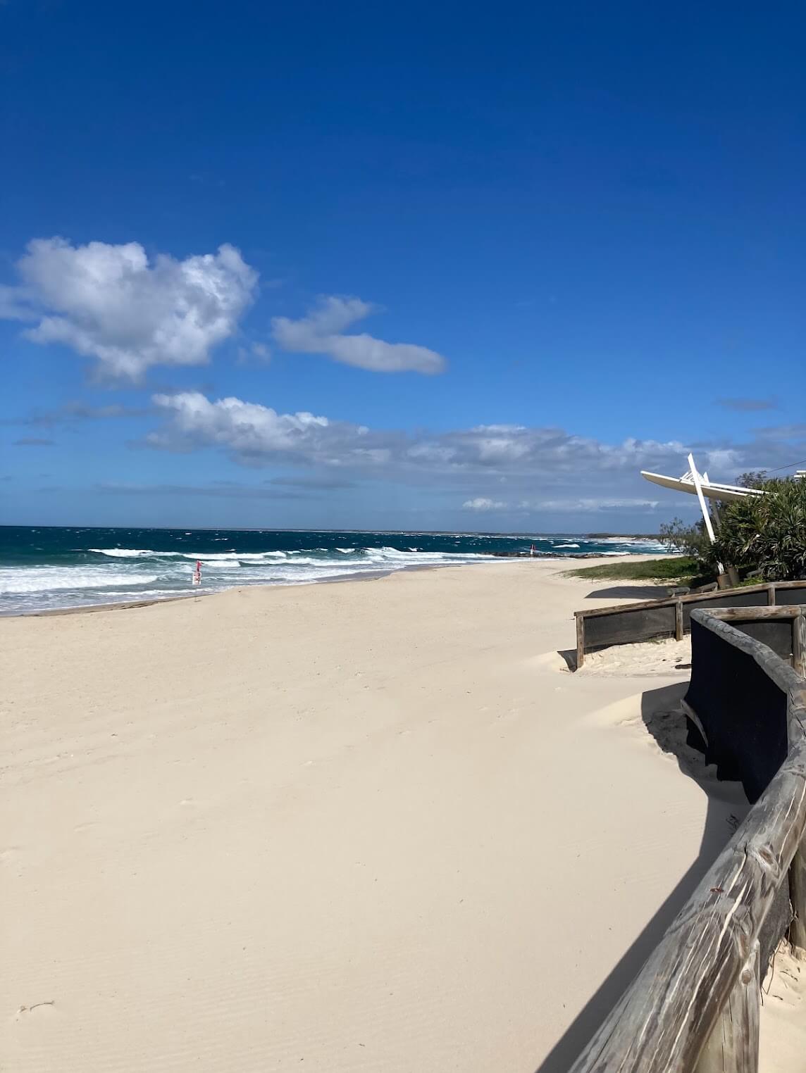 entry to beach from right onto white powdery sand