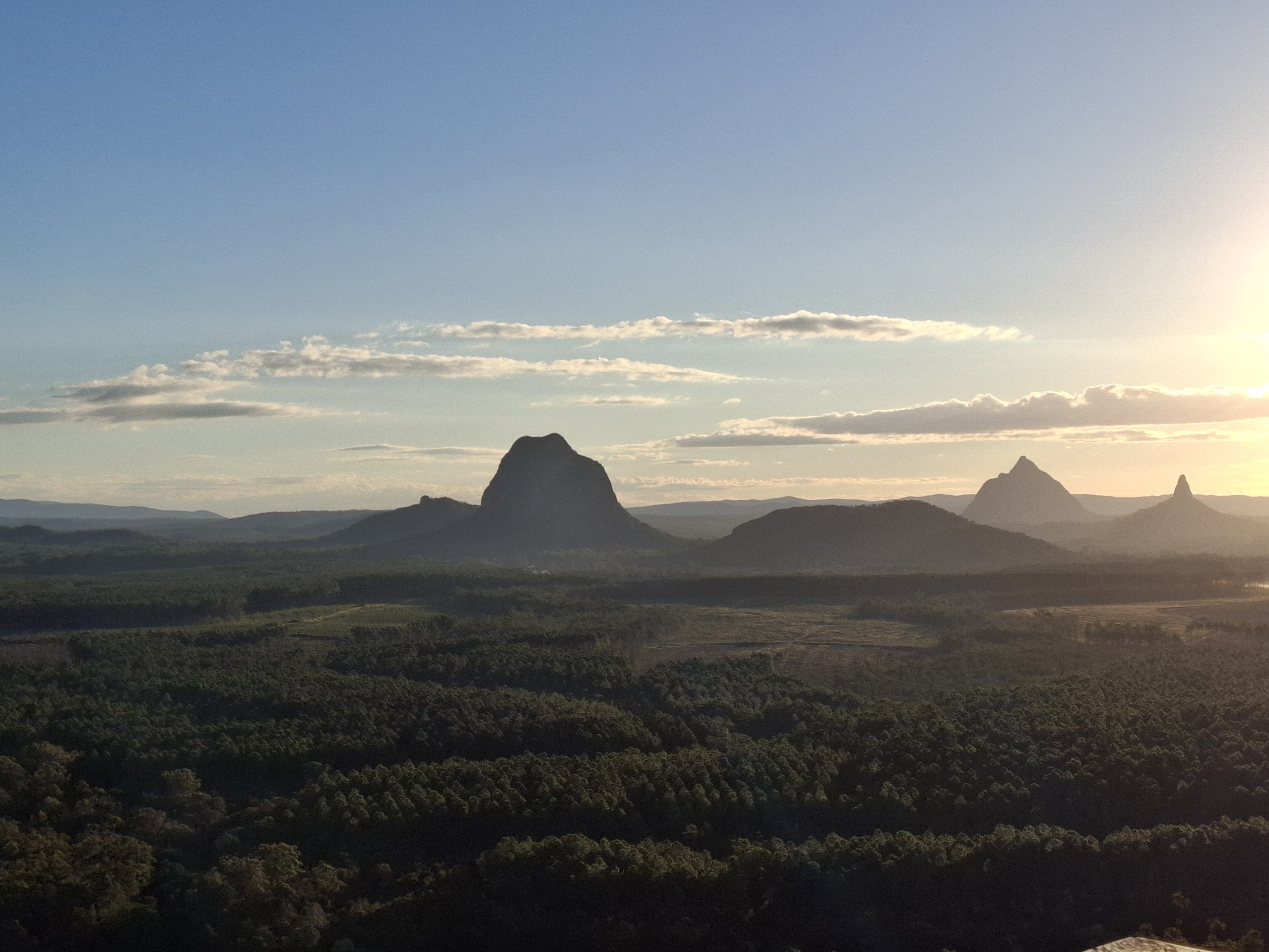 sunset views of glass house mountain peaks from wild horse mountain