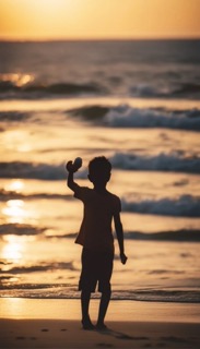 boy on beach at sunrise boy on beach at sunrise