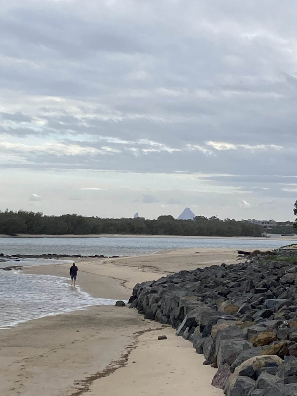 Glass house mountains in distance as seen from Caloundra beach