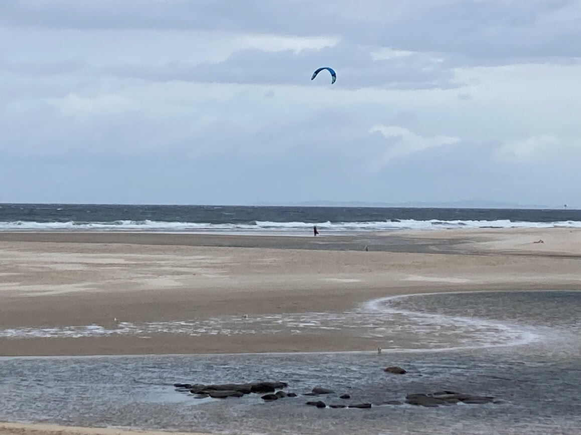 lone kite surfer enjoying winter winds