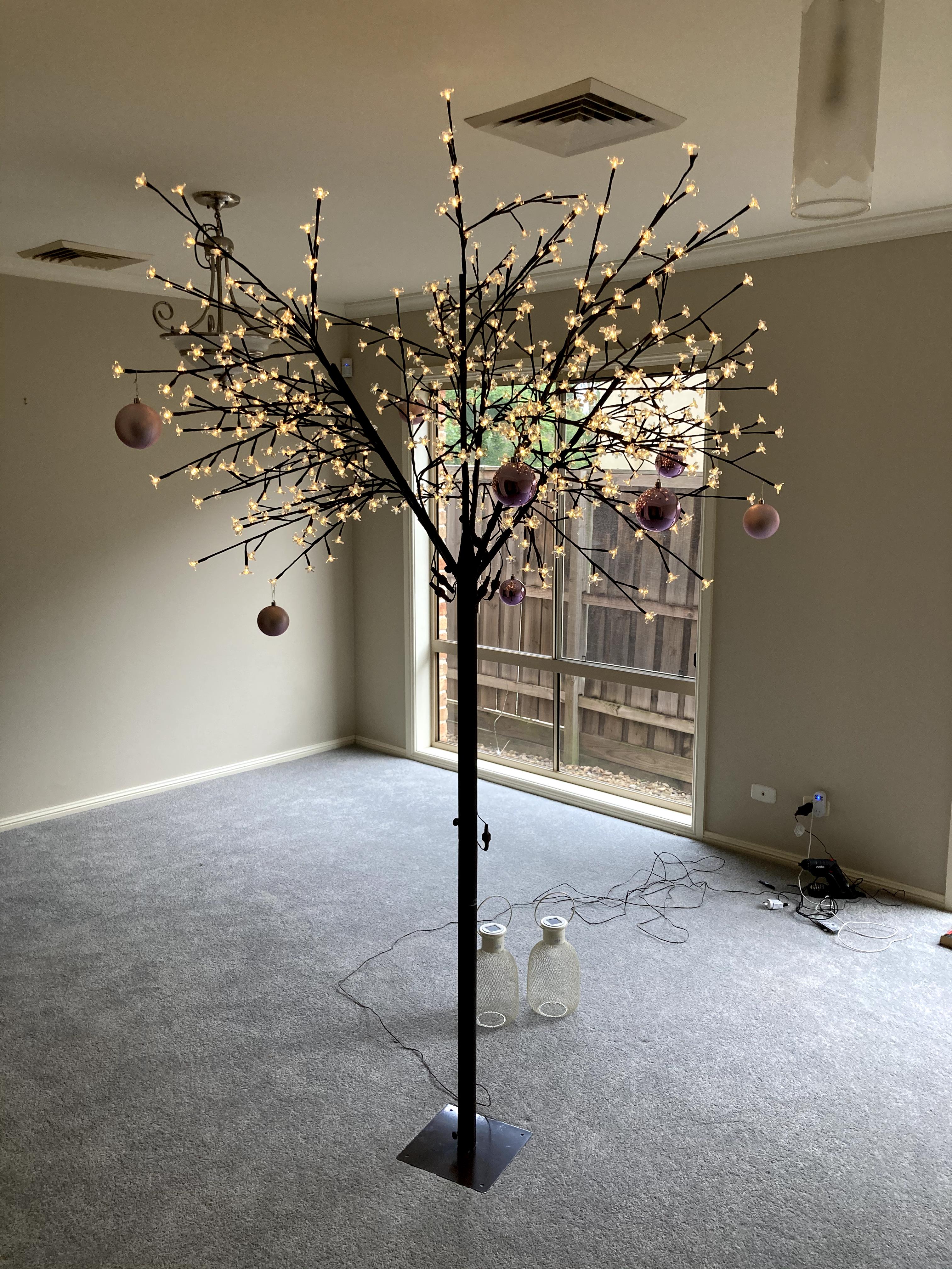 artificial cherry tree in empty living room artificial cherry tree in empty living room