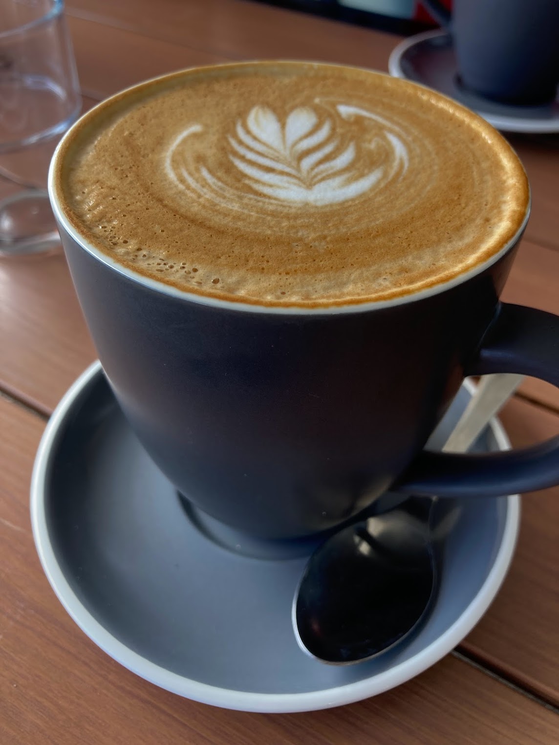 Flat white at The Frog's kitchen. Leaf design in the milk Flat white at The Frog's kitchen. Leaf design in the milk