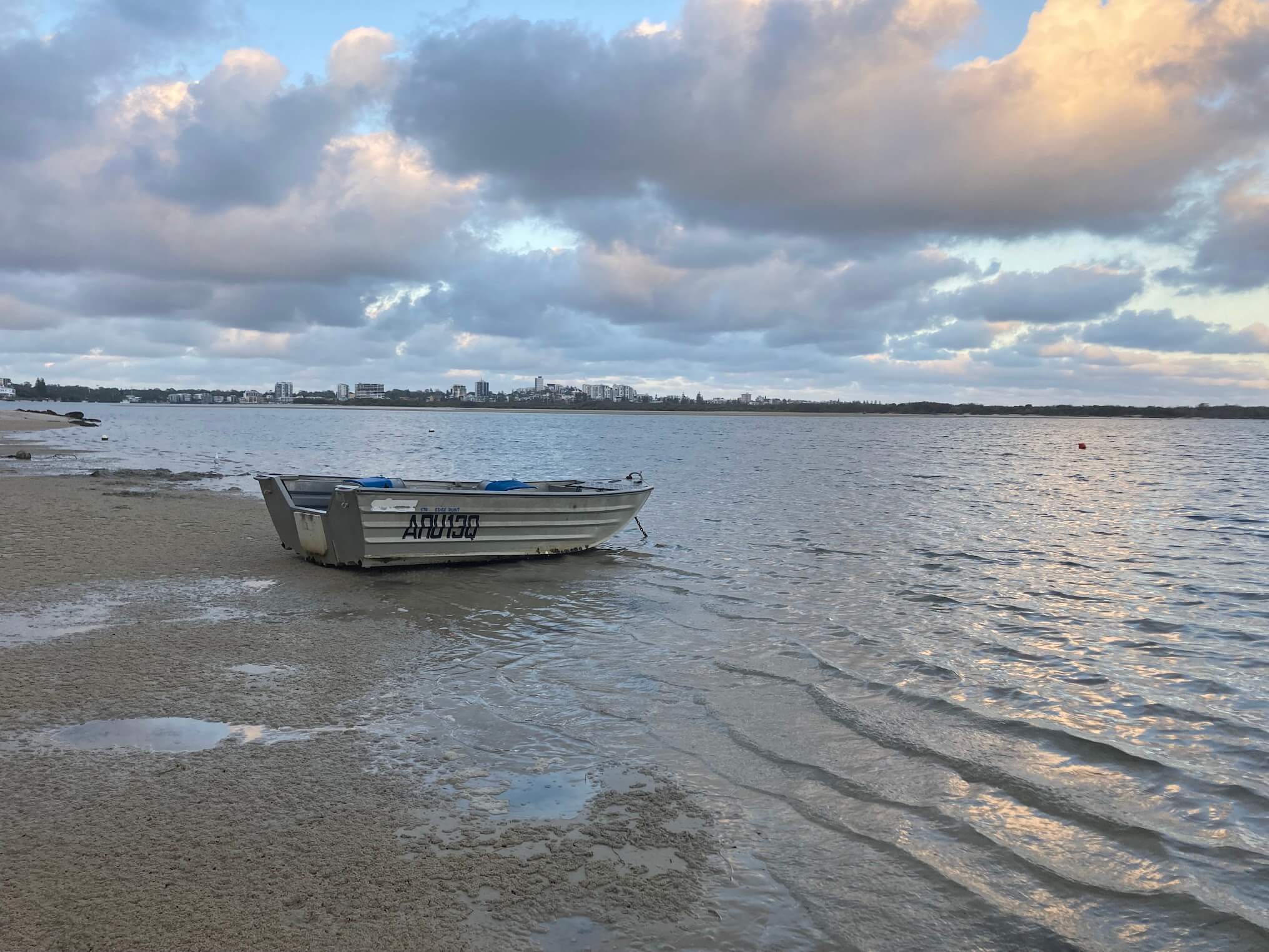 boat at Golden Beach during low tide