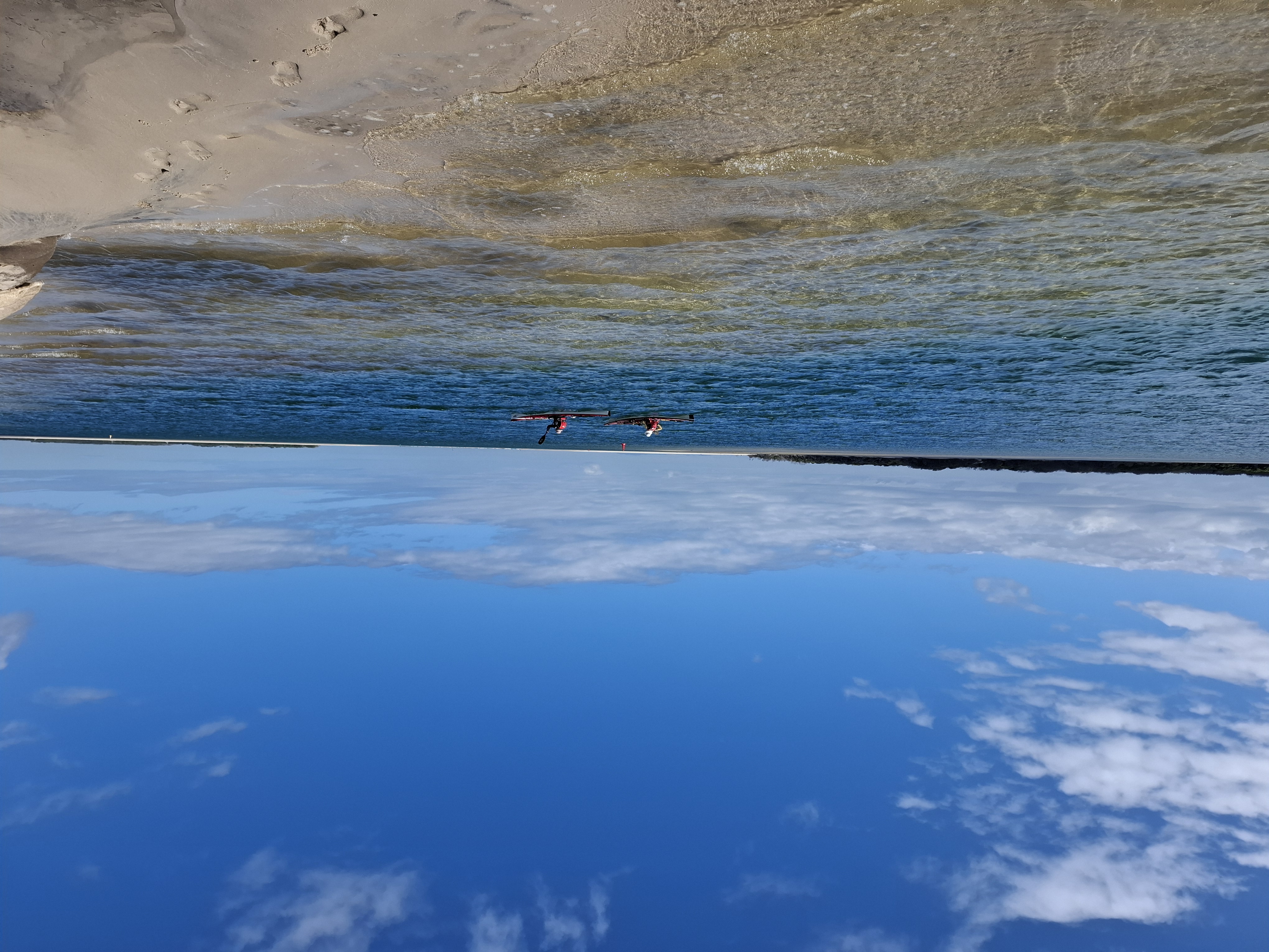 couple kayaking at Golden Beach couple kayaking at Golden Beach