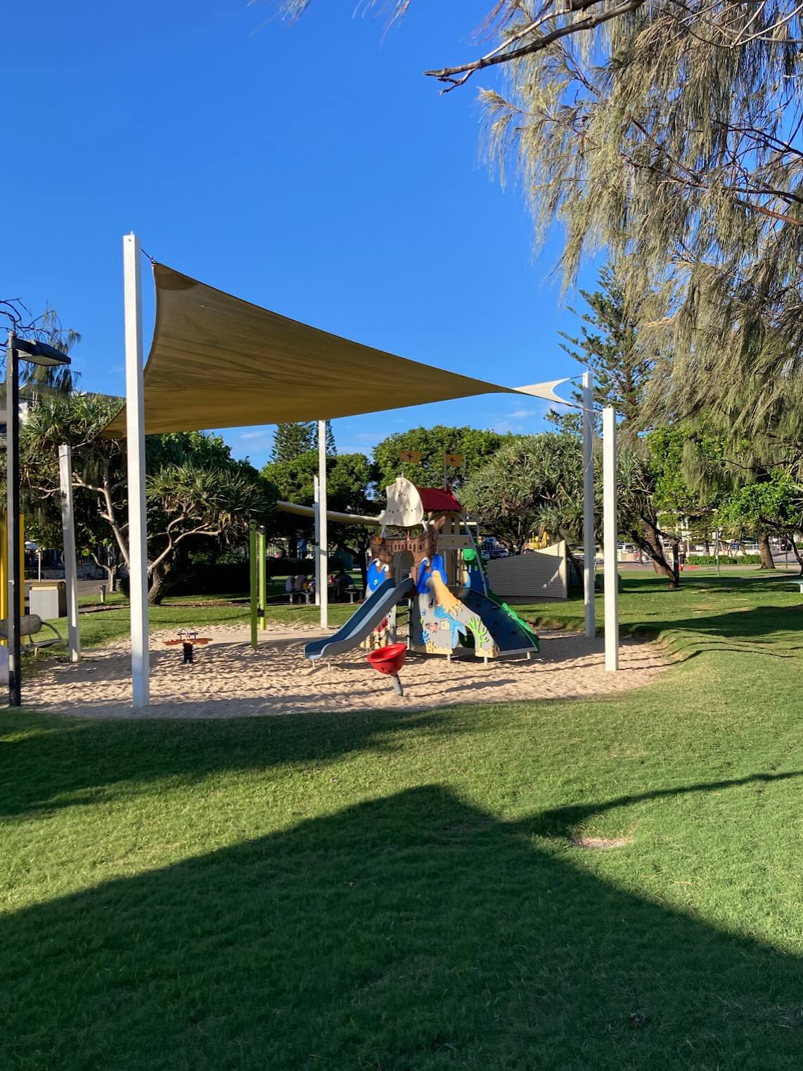 Shaded children's playground with slides and swings at Kings Beach