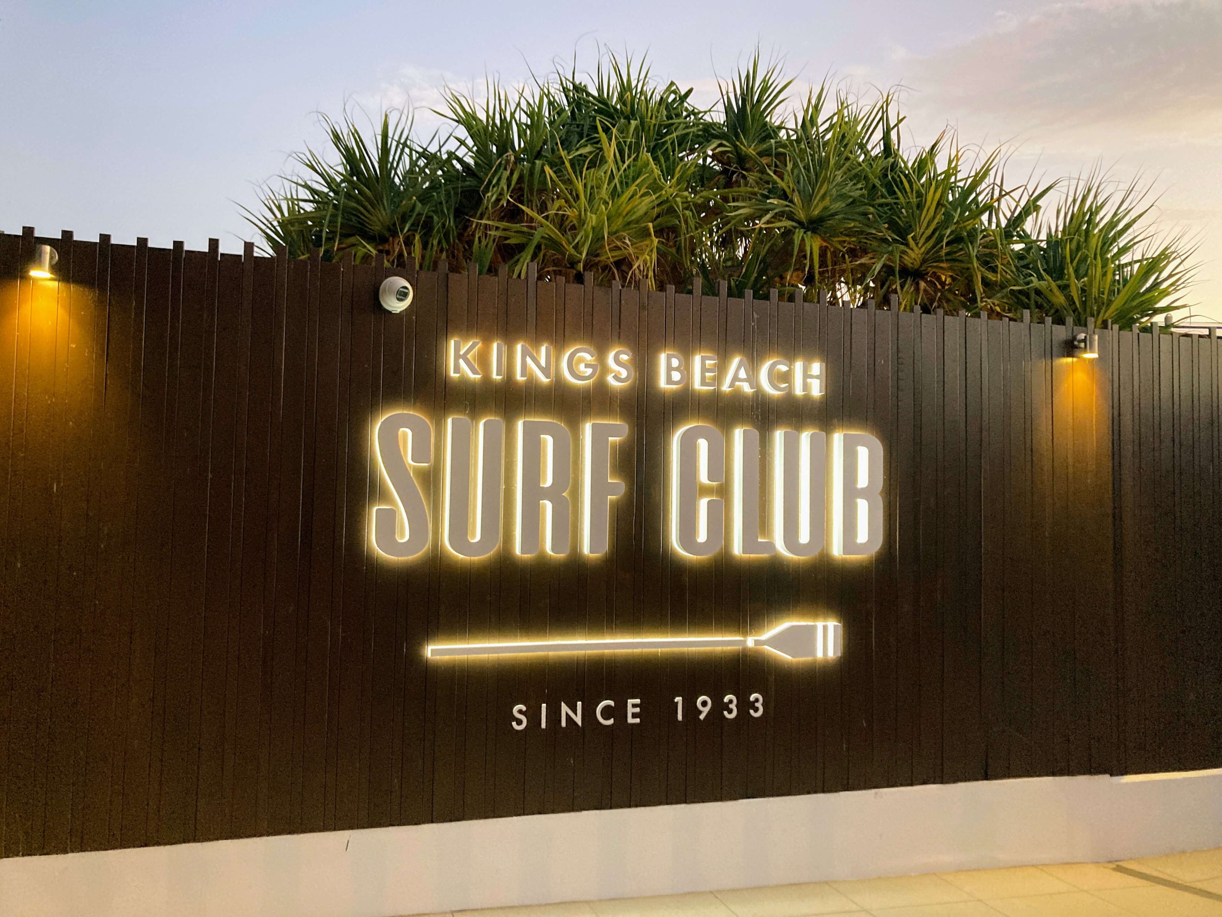 surf club sign at sunset