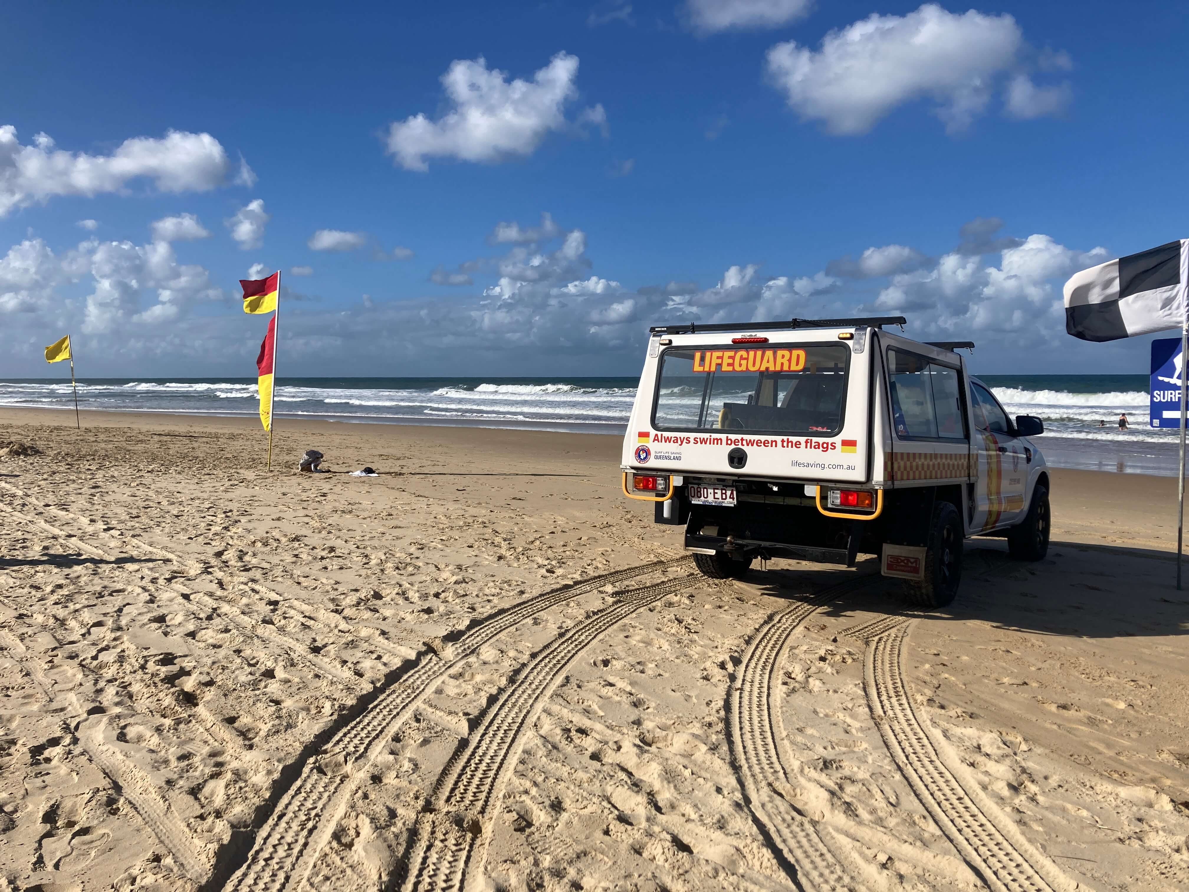 lifeguard vehicle parks facing the sea