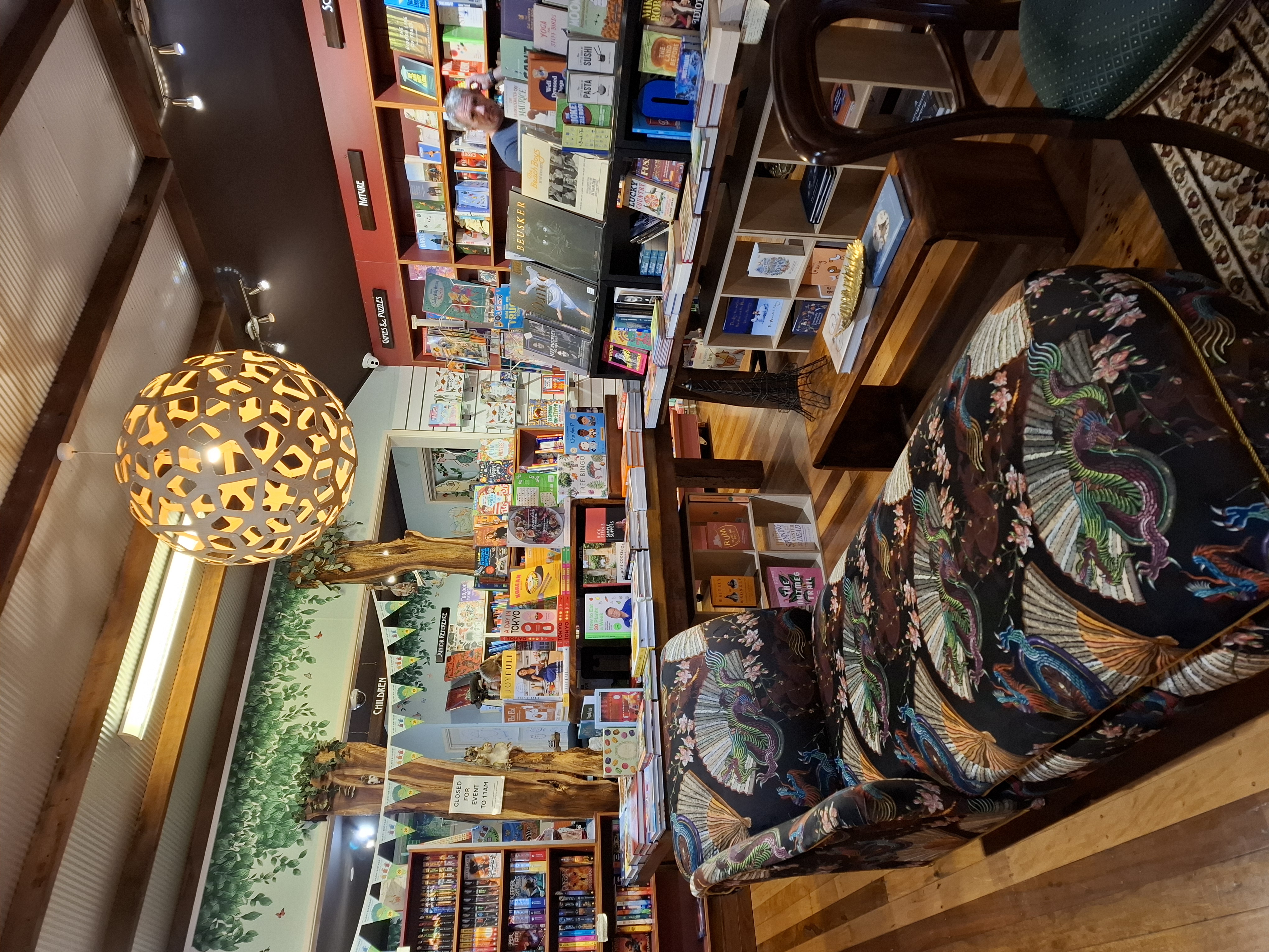 inside a bookshop, books and a comfy place to sit inside a bookshop, books and a comfy place to sit