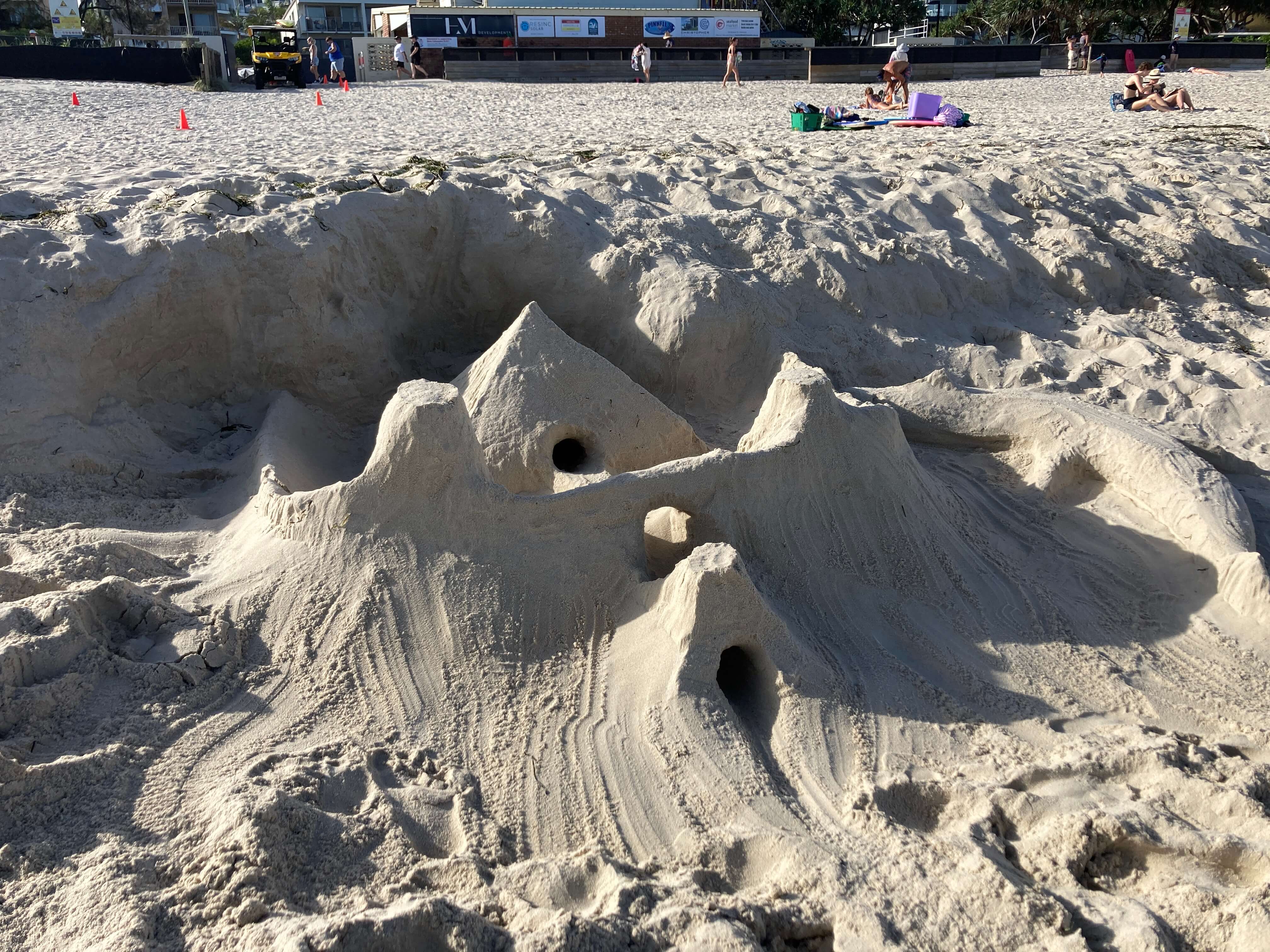 sand castle with tunnels on an Australian beach