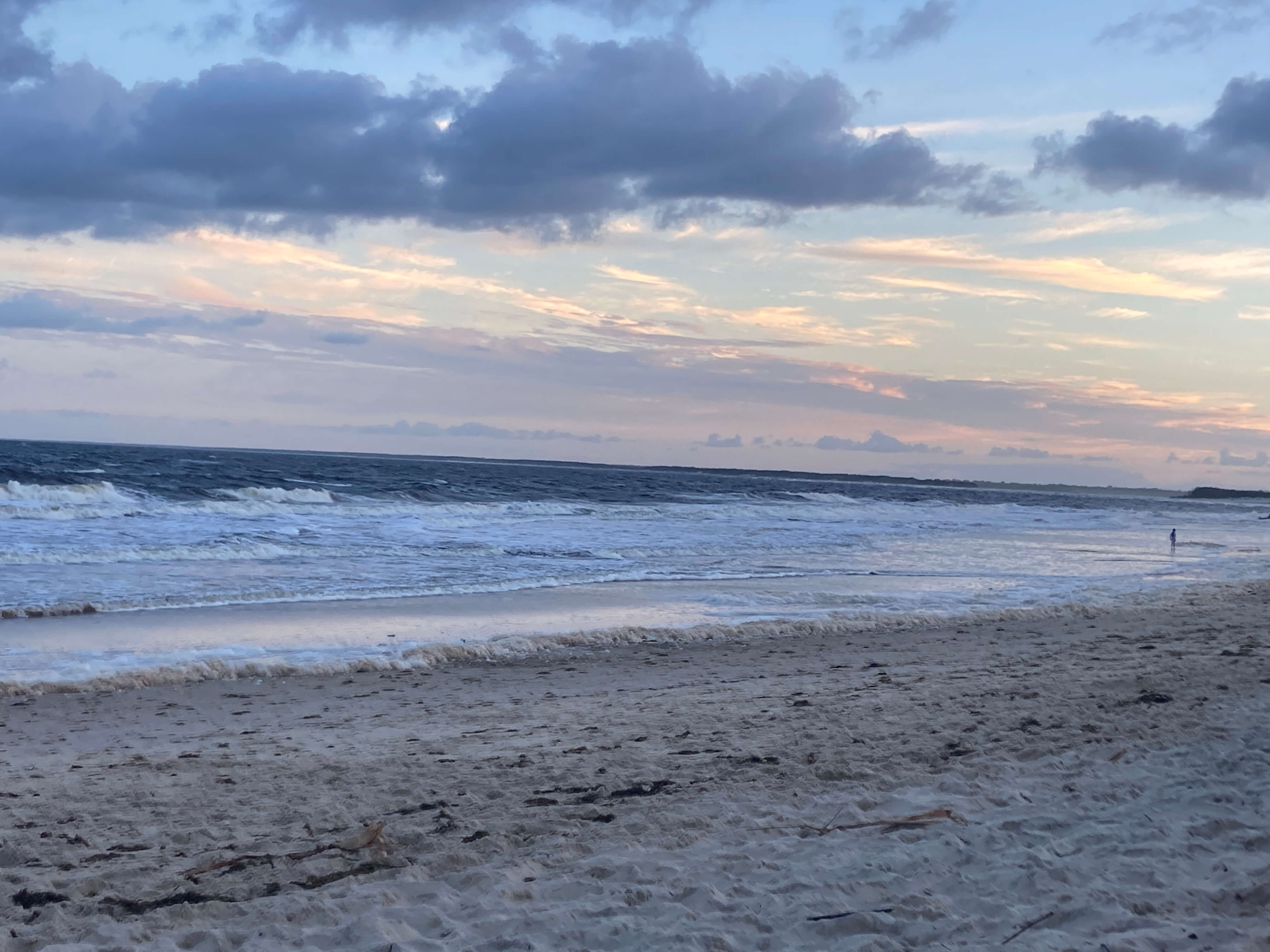 last rays of sun over a deserted beach