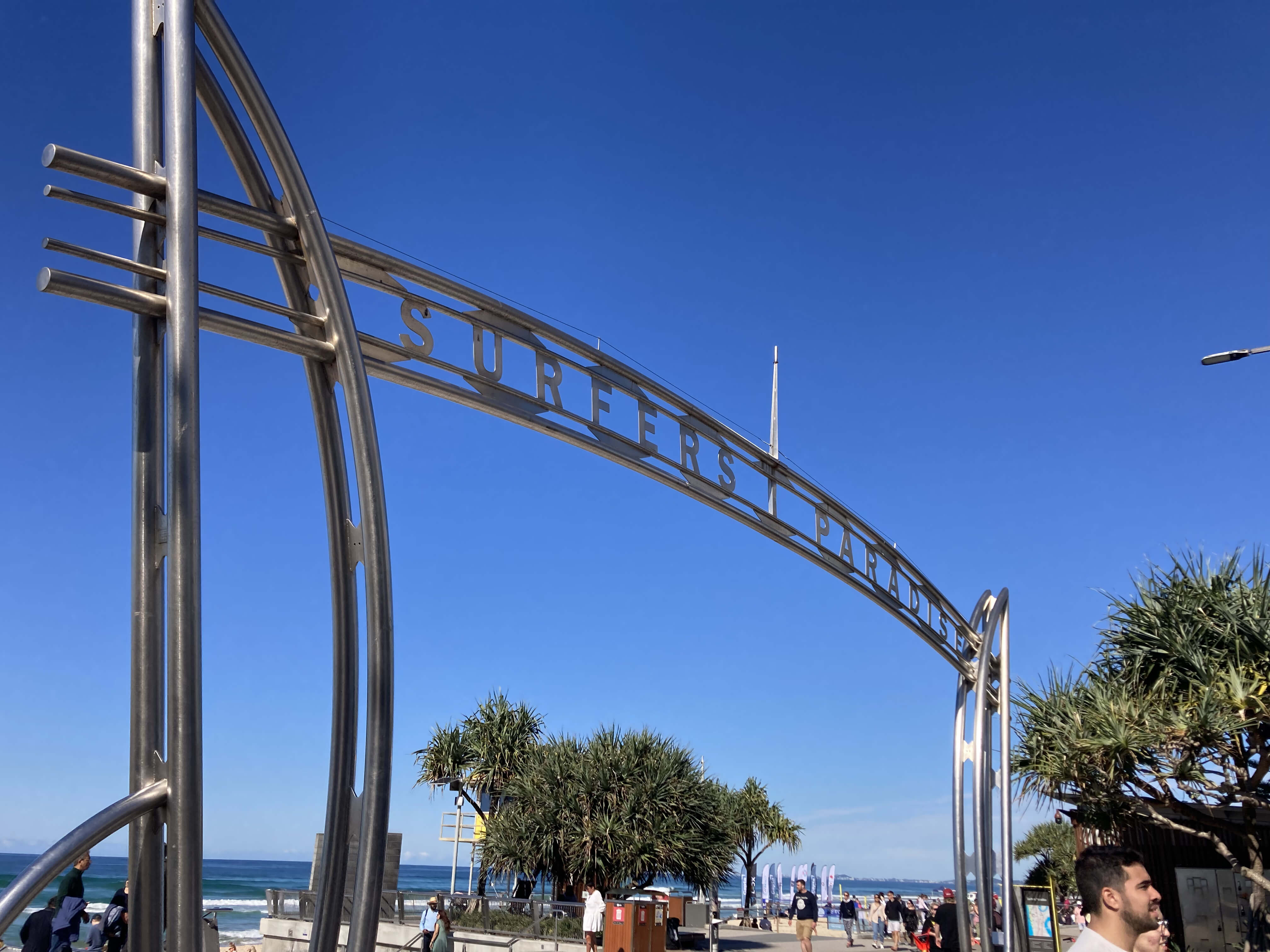 Sign at beach gold coast qld Surfers Paradise taken on angle from left. Sea in background Sign at beach gold coast qld Surfers Paradise taken on angle from left. Sea in background