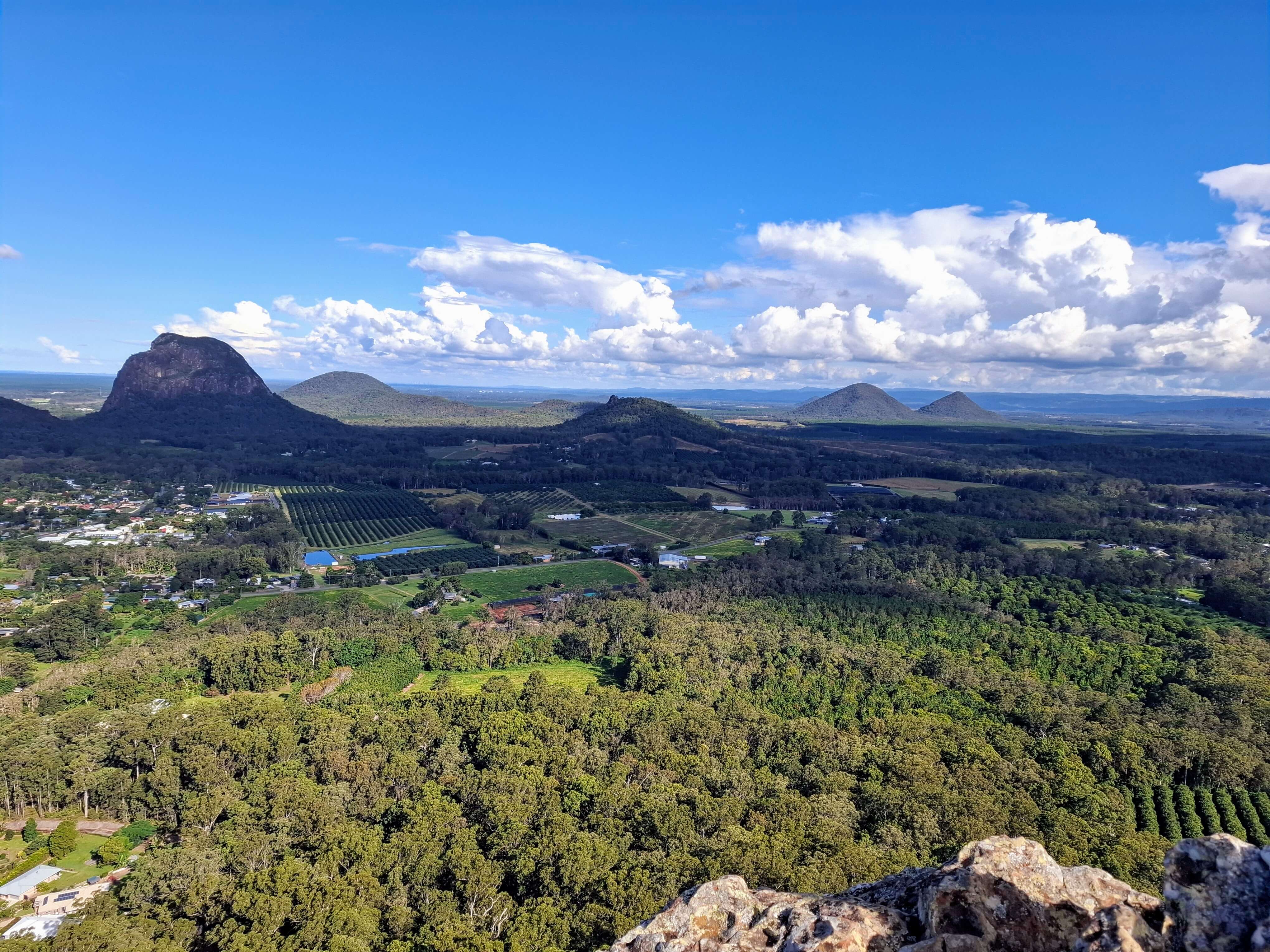 view from top to farms and homes at base of Ngungun